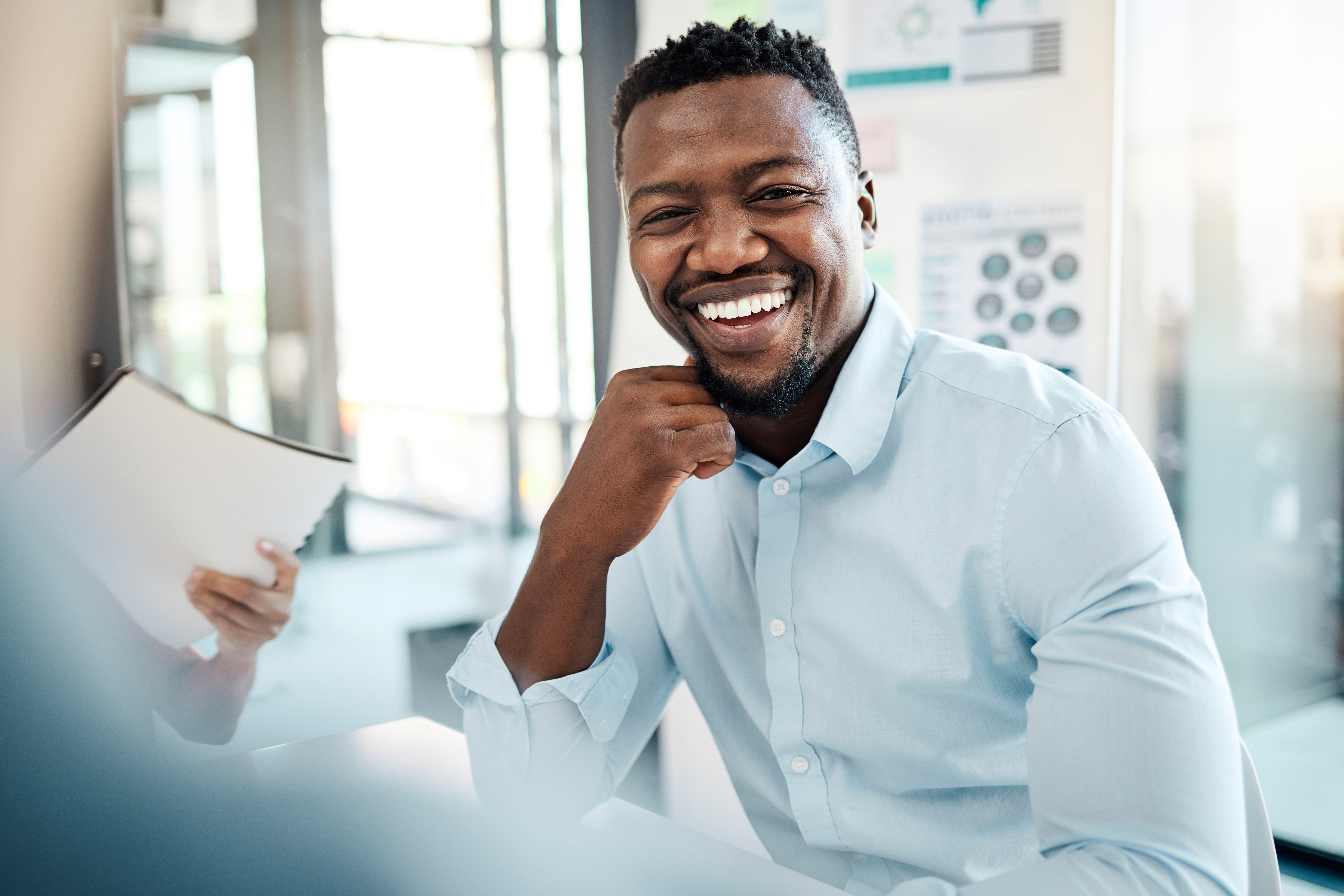Black business man, employee and smile of a office worker listening to a presentation. Portrait of